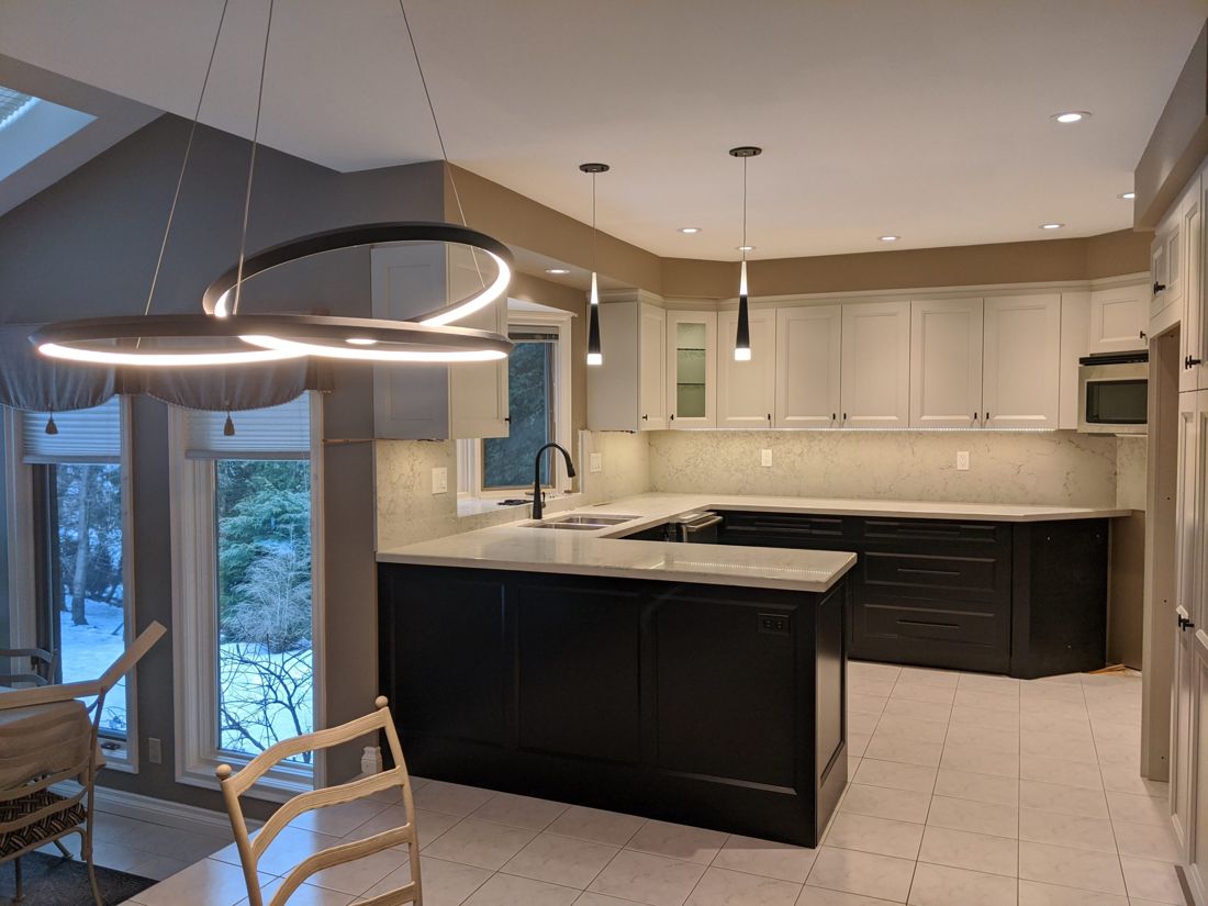 A kitchen we wired, lit by a custom circular LED pendant
